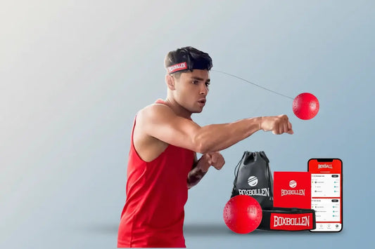 Man using a boxing training ball with accessories on a white background
