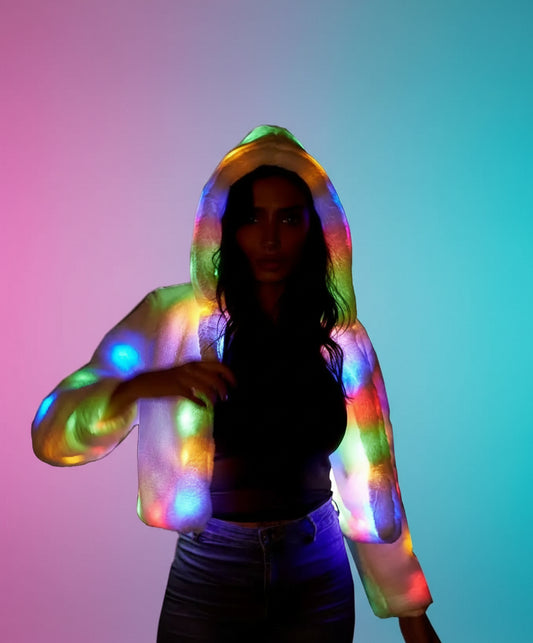 Person wearing a colorful LED hoodie in a dark setting