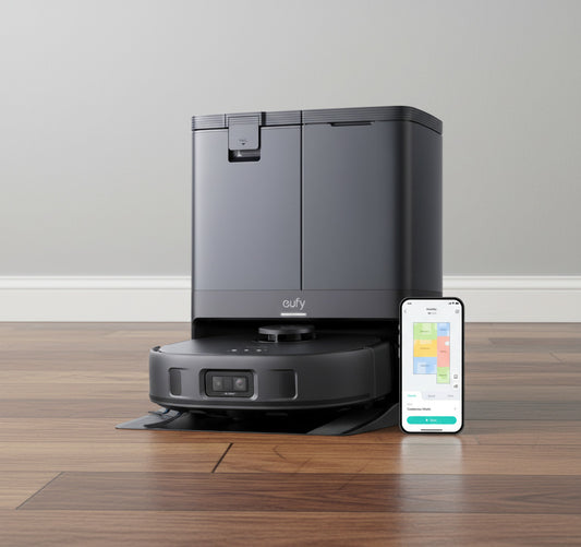 Robotic vacuum cleaner with smartphone displaying app interface on a white background